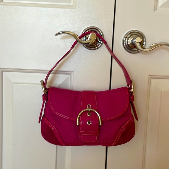 Coach fuchsia bag perfect for a Saturday night as an accent to your outfit!